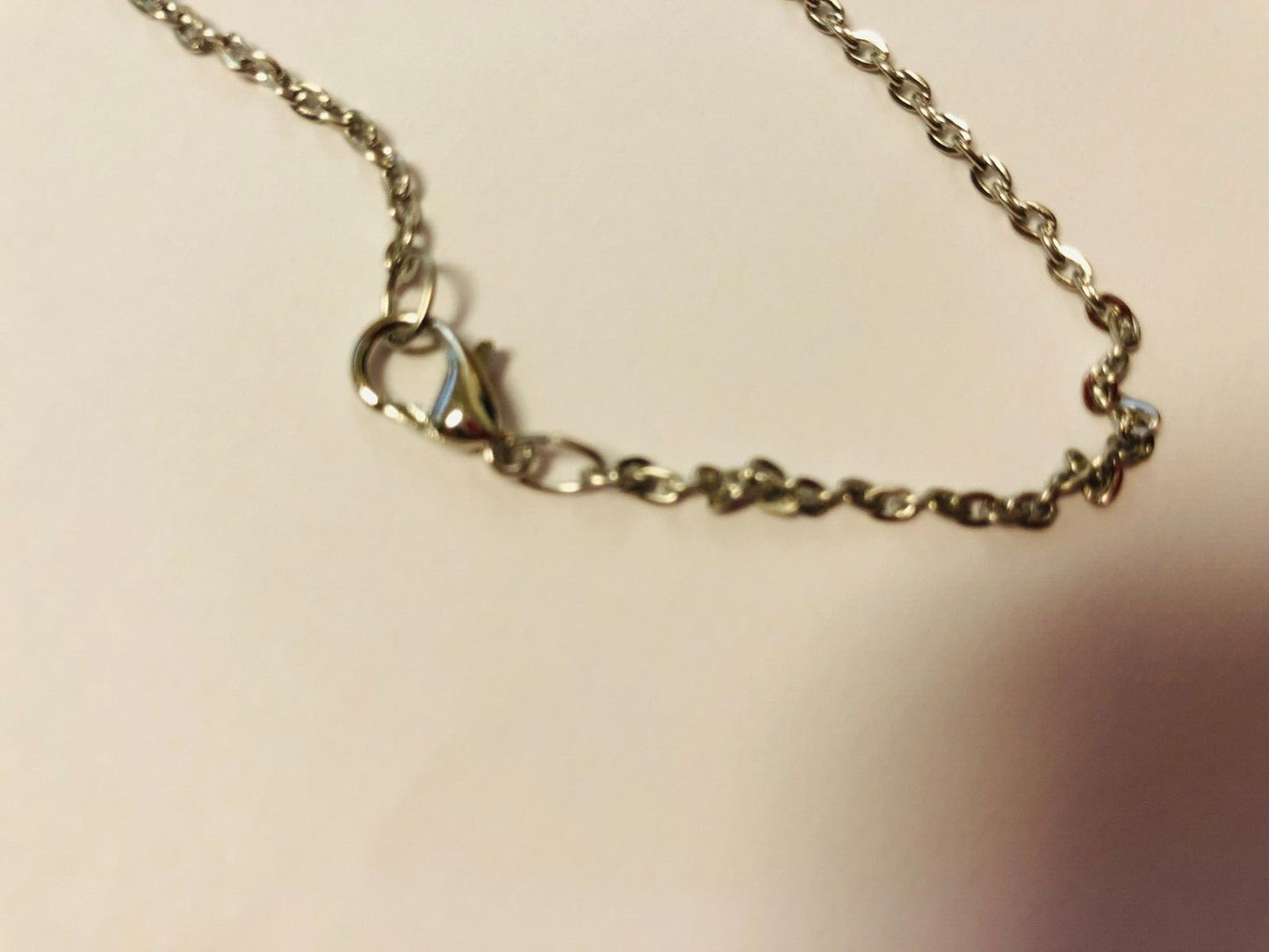 Two-sided Saint Michael the Archangel Guardian Angel necklace pendant, unbranded jewelry featuring detailed religious design.