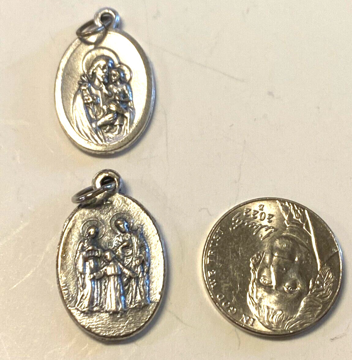 Saint Joseph Holy Family Medal from Italy, featuring religious imagery, associated with Christian collectibles by Bob and Penny Lord.