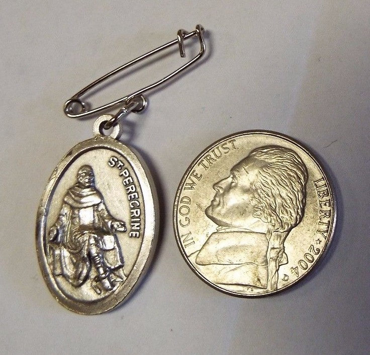 Saint Peregrine Cancer Saint medal relic from Bob and Penny Lord, religious Christian collectible with detailed design.