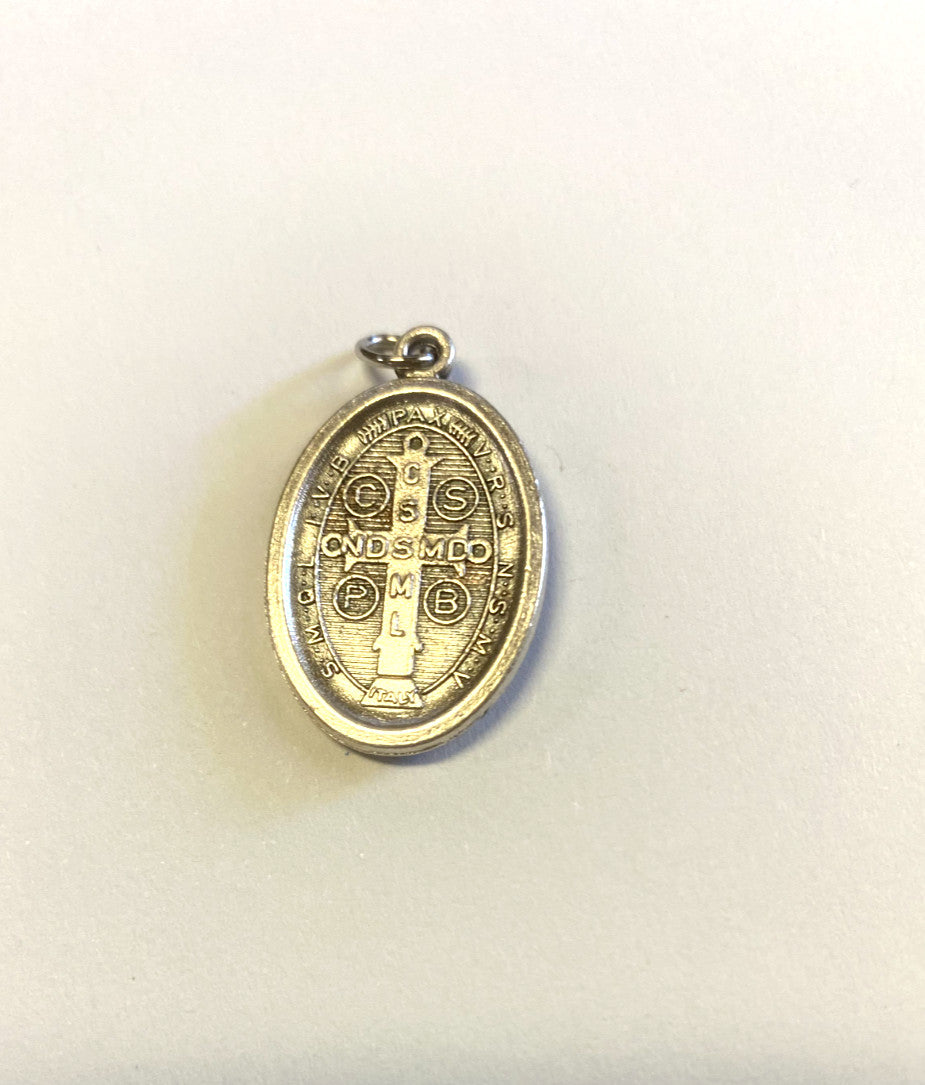 Silver tone Saint Benedict medal from Bob and Penny Lord featuring religious symbols and detailed engraving, used as a Christian collectible.