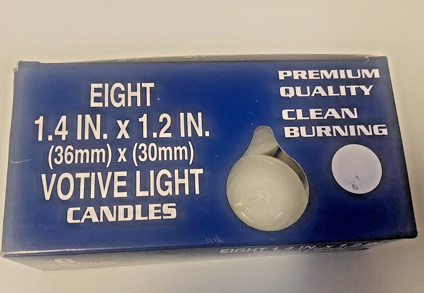 Set of 8 small votive candles, 1.5-inch, from Bob and Penny Lord Journeys of Faith, with religious imagery on the packaging.