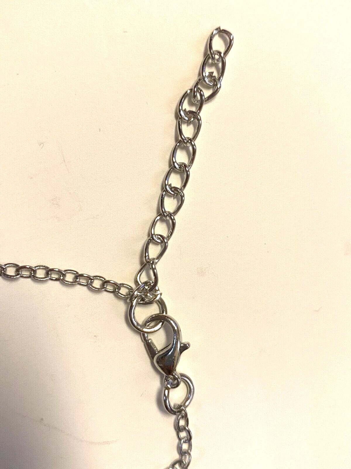 Silver tone 22-inch necklace with Christian religious pendant from Journeys of Faith, featuring symbolic Christian design.