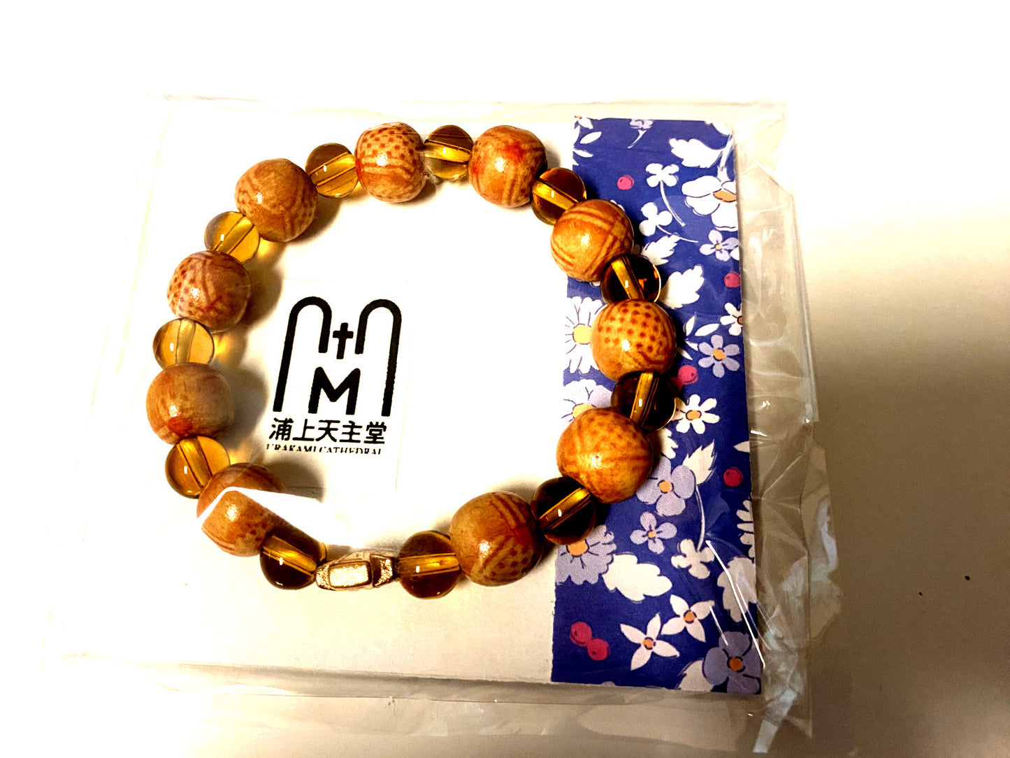 Light brown wood and clear bead stretch bracelet by Bob and Penny Lord, Christian jewelry with spiritual and religious significance.