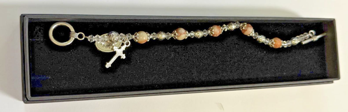 Light brown Madonna del Parto Miraculous Medal bracelet featuring religious jewelry from Journeys of Faith, with detailed pendant and beads.
