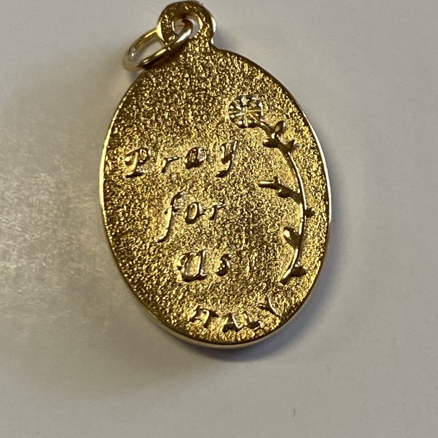 Gold and silver oval medal of Our Lady of Guadalupe, Christian religious collectible by Bob and Penny Lord Journeys of Faith.