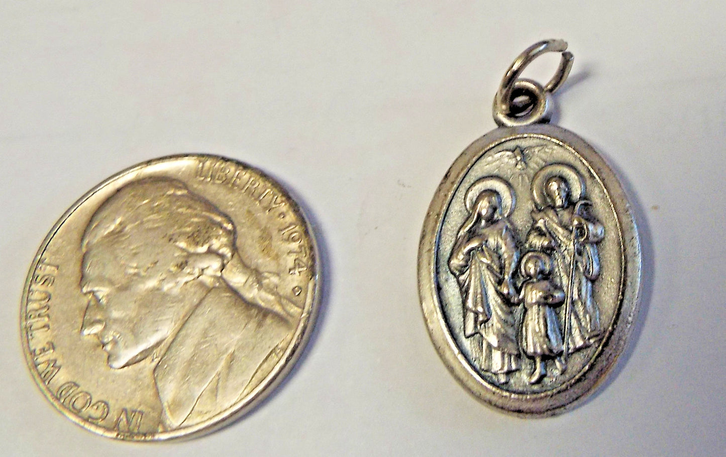 Holy Family and Holy Spirit medal from Italy, Christian religious medal by Bob and Penny Lord, depicting sacred Christian imagery.
