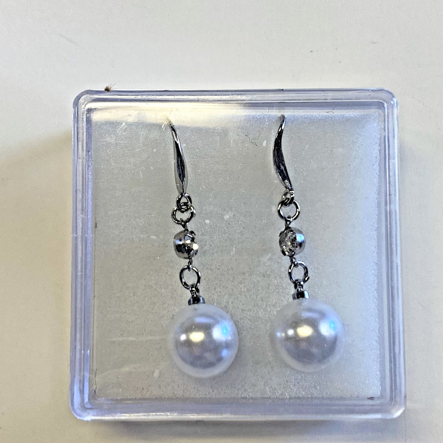 Berkander faux pearl dangle earrings, 1.5 inches long, featuring elegant white faux pearls and silver-toned hooks for fashion jewelry.