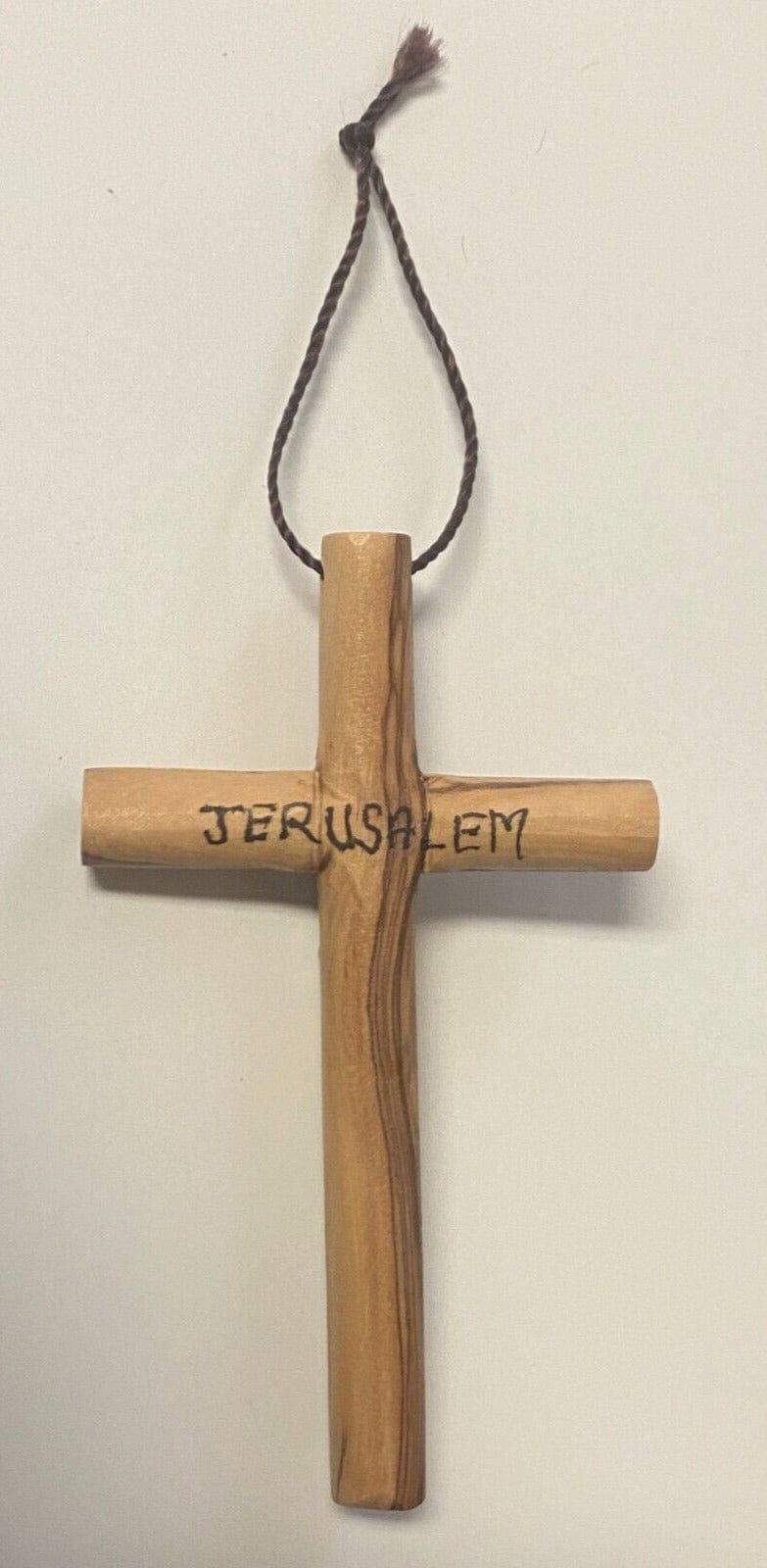 Round olive wood cross, 4.87 inches, from Jerusalem, handcrafted Christian crucifix by Bob and Penny Lord, showcasing natural wood grains.