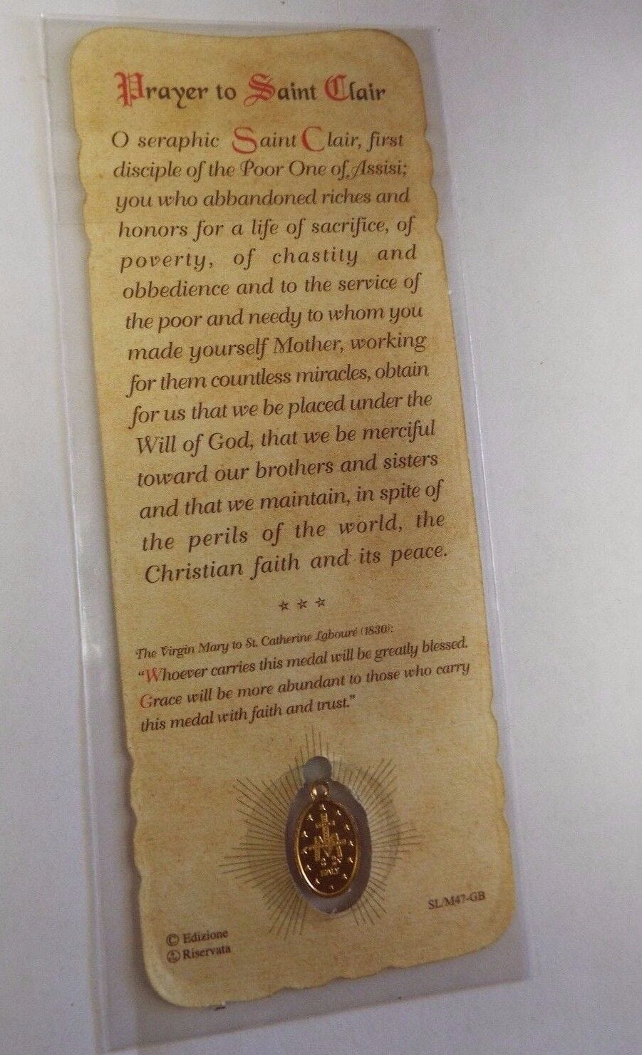 Saint Clare of Assisi prayer card with medal, featuring religious imagery and Christian symbolism, from Bob and Penny Lord.