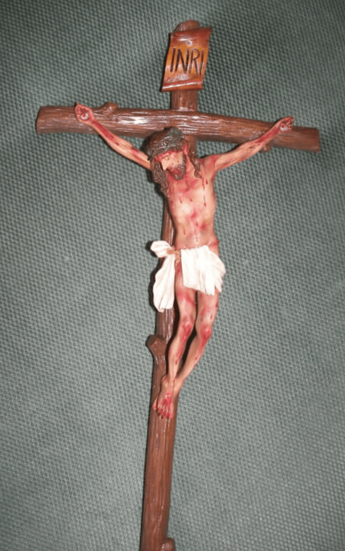 Handmade 24-inch crucifix crafted in Colombia, featuring intricate details and religious design by Bob and Penny Lord.