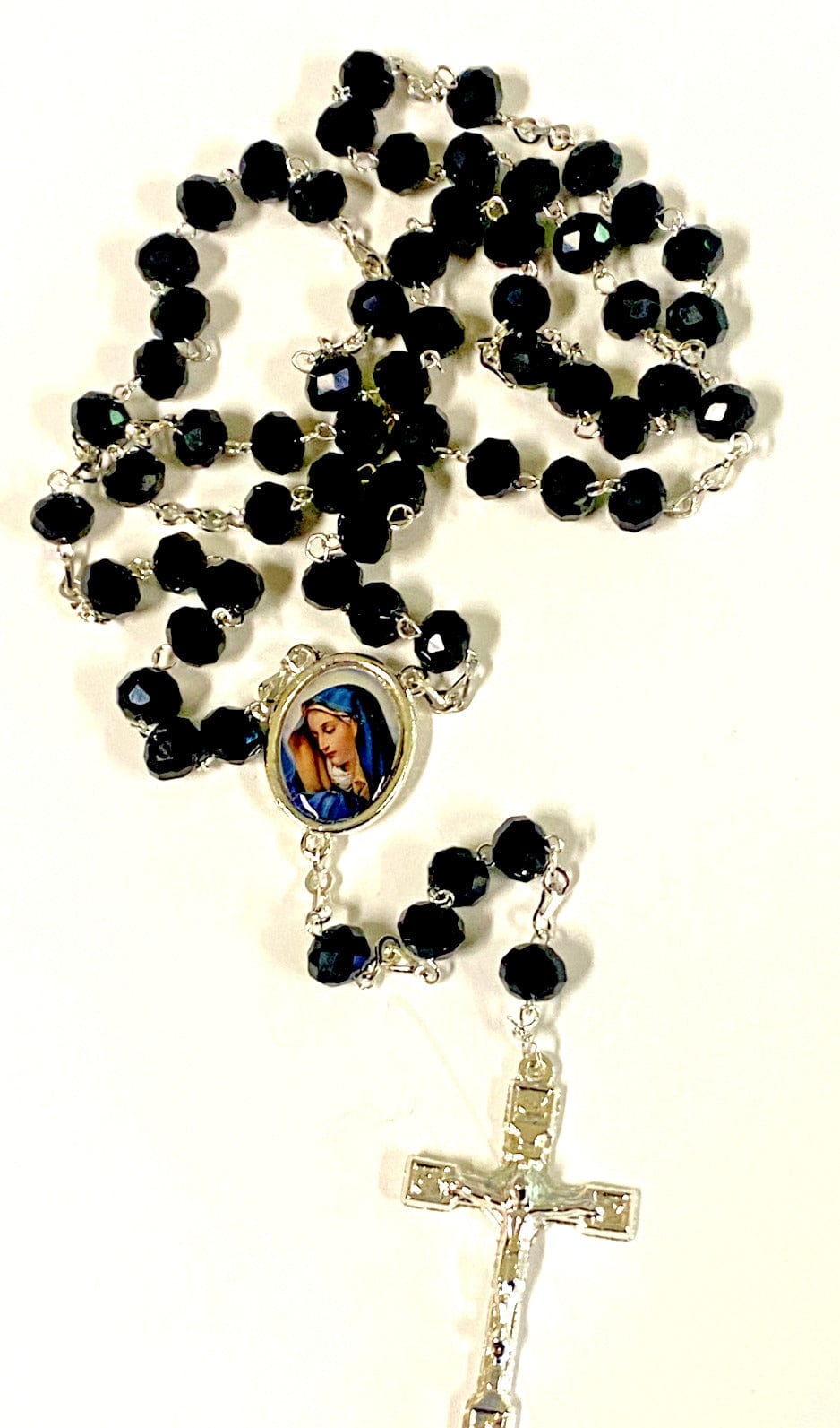 Black handmade Blessed Mother rosary with beads and crucifix, crafted in Colombia by Bob and Penny Lord.