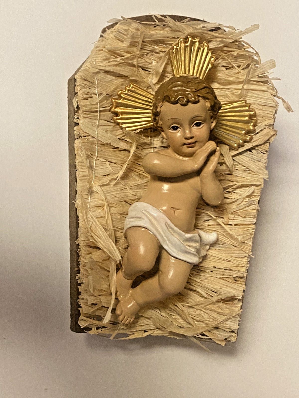 Infant Jesus in a 5-inch manger statue by Bob and Penny Lord, depicting a Christian religious figure in a peaceful scene.