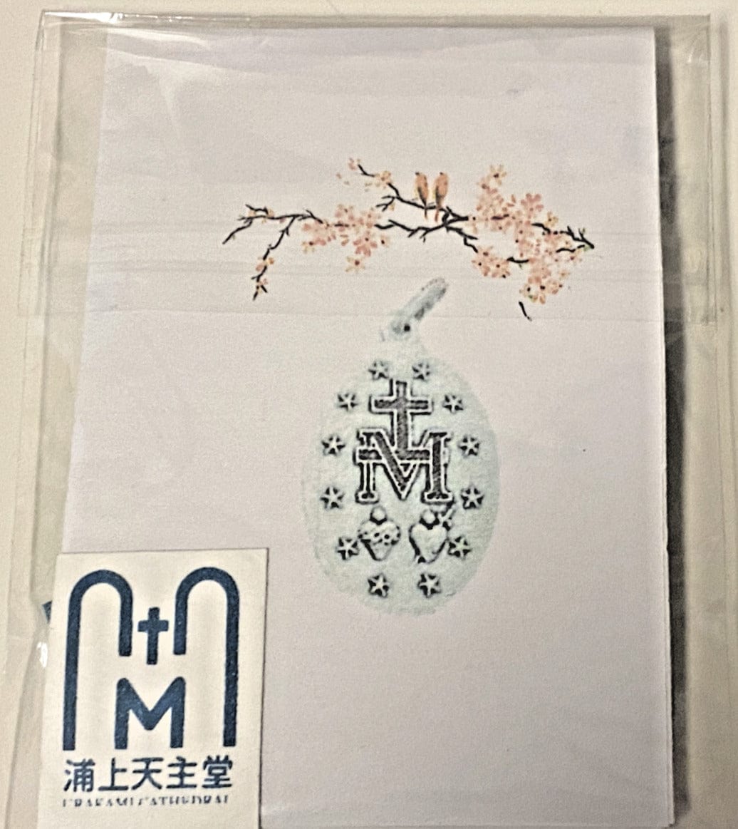 Silver tone Our Lady of the Miraculous Medal jewelry from Japan, featuring religious Christian symbolism and detailed design.