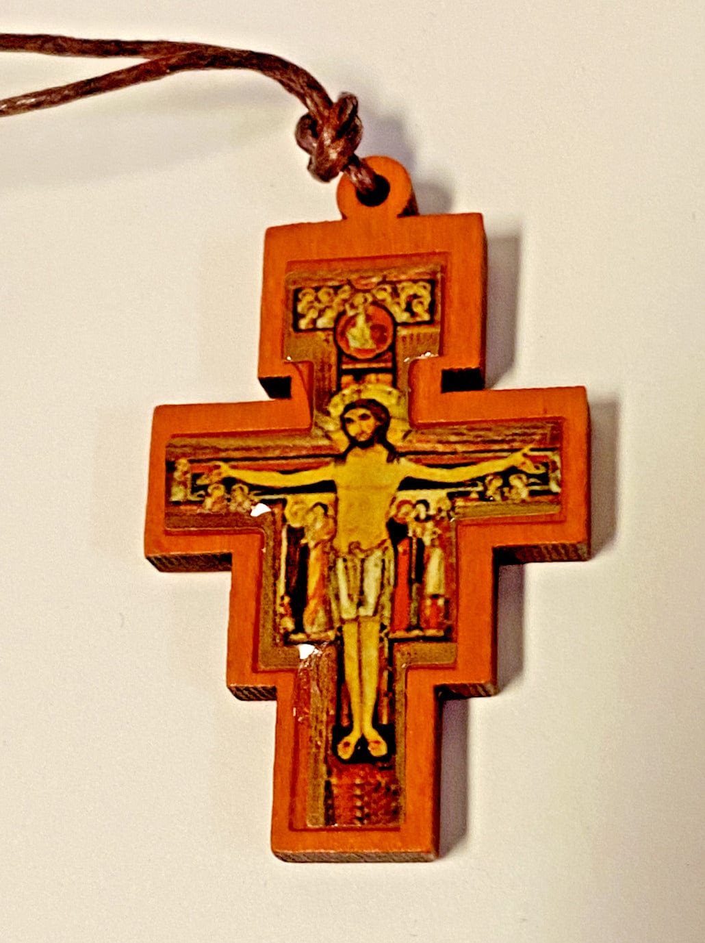 San Damiano wood crucifix pendant on corded necklace, Christian religious jewelry, crafted by Bob and Penny Lord.
