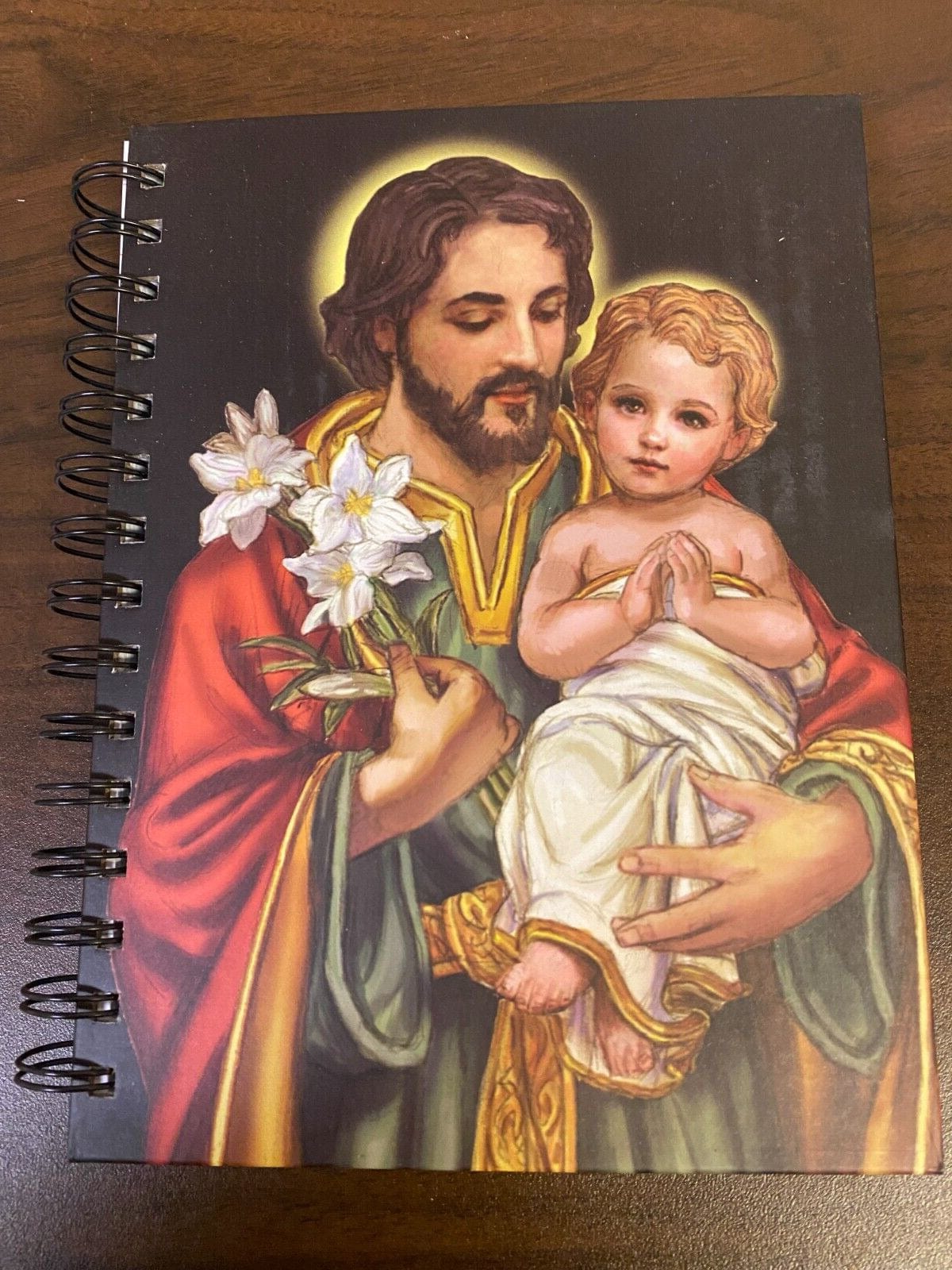 Hardcover journal featuring Saint Joseph with Child, religious Christian figure statue by Bob and Penny Lord.