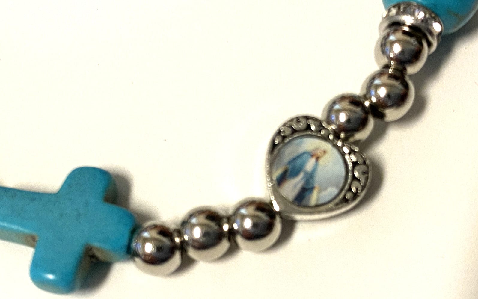 Blue and white beaded stretch bracelet with Miraculous Medal, Christian jewelry by Bob and Penny Lord from Japan.