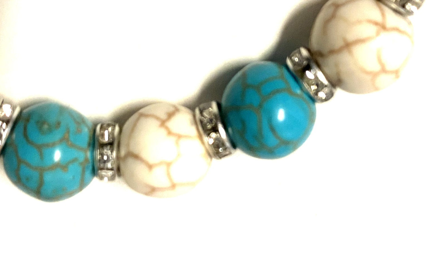 Blue and white bead stretch bracelet with Miraculous Medal, Christian jewelry by Bob and Penny Lord from Japan.