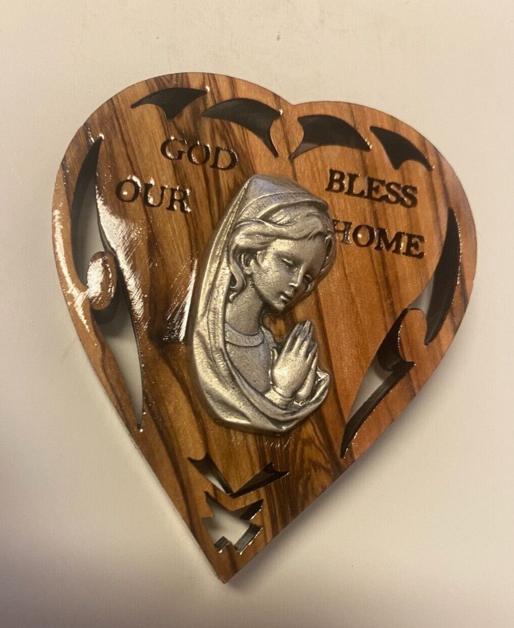 Blessed Mother olive wood magnet from Bethlehem, Christian religious collectible by Bob and Penny Lord, featuring a detailed religious design.