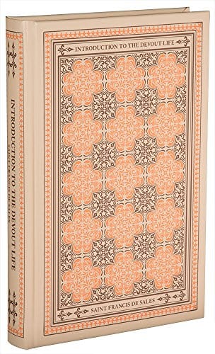 Hardcover guidebook titled "Devout Life" by Bob and Penny Lord, featuring religious book cover with spiritual imagery.