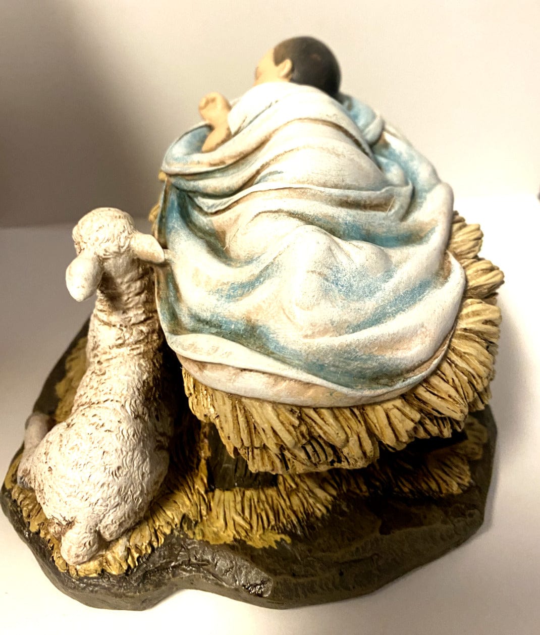 Sleeping Baby Jesus statue with lamb, Christian religious figurine by Bob and Penny Lord, symbolizing God's gift of love.