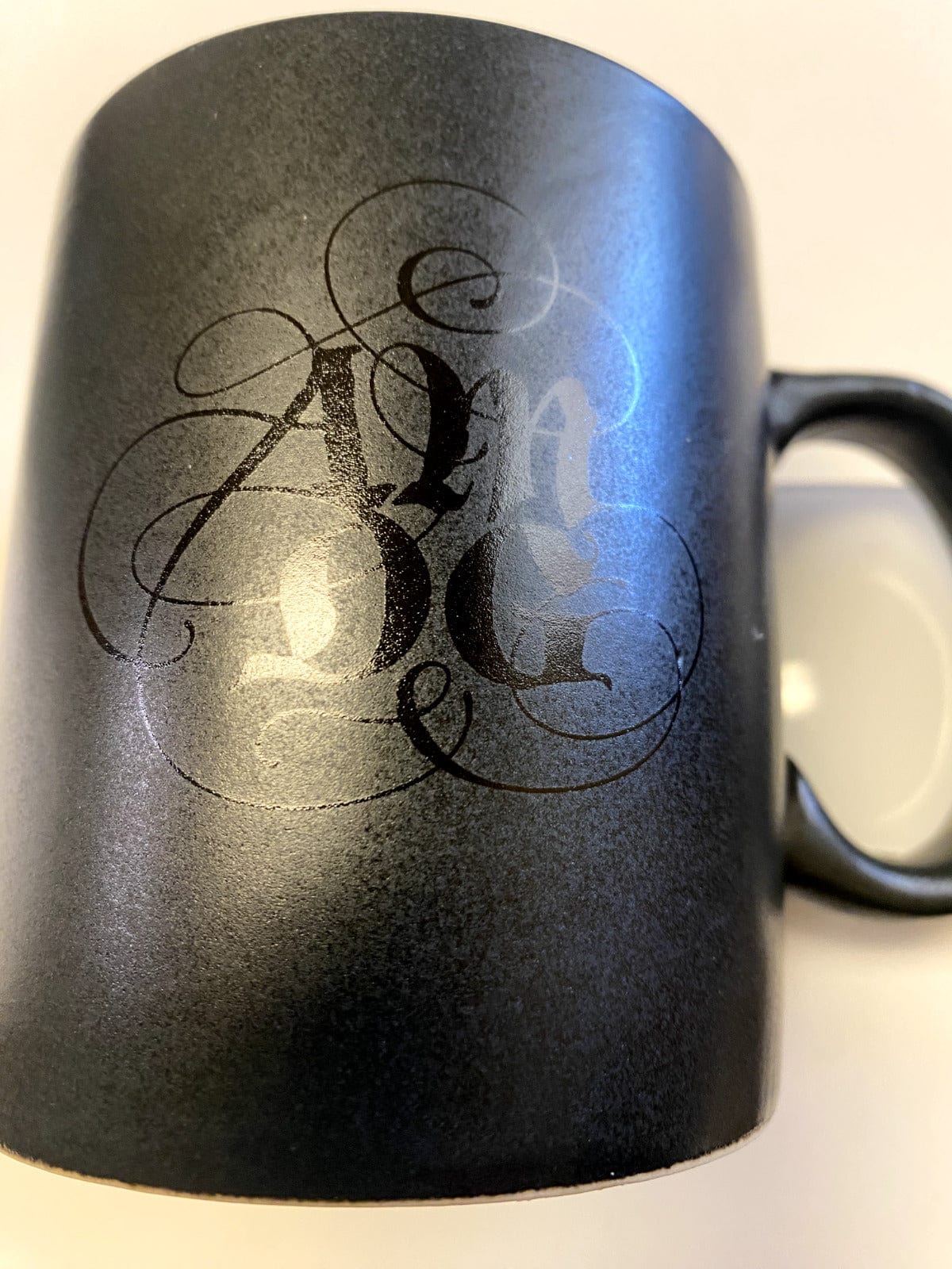 Dark gray 14 oz. ceramic mug with "For the Great Glory" inscription by Bob and Penny Lord, Christian collectible with spiritual design.