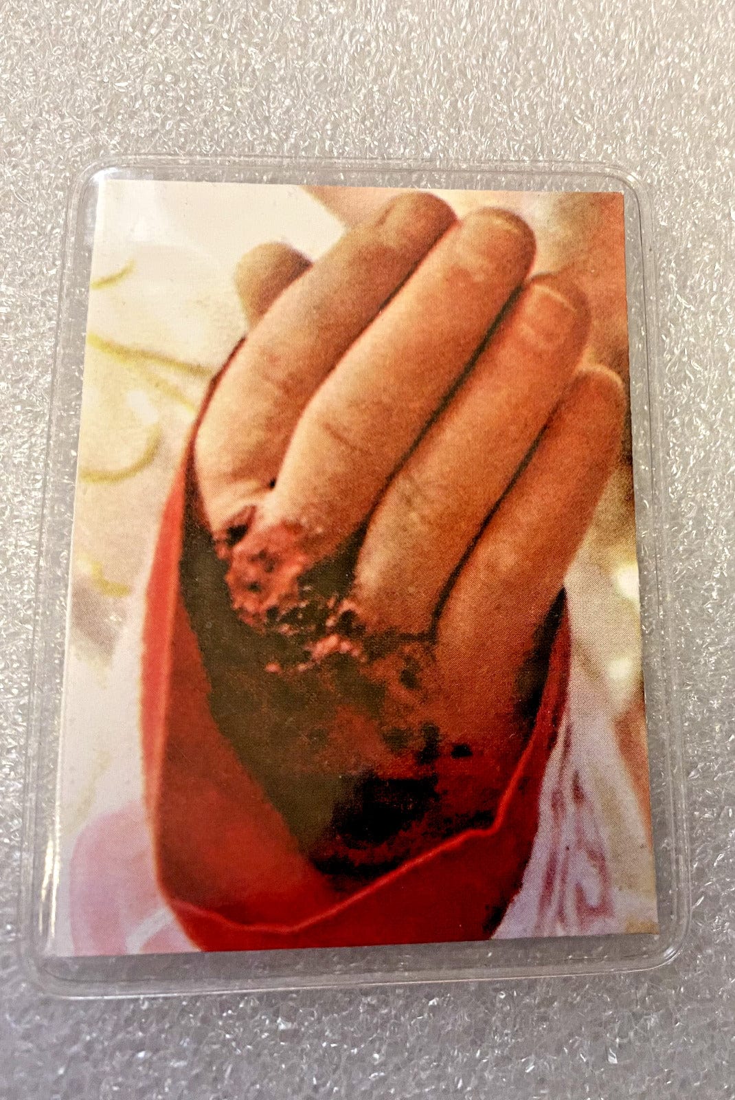 Vinyl encased Padre Pio 3rd class relic collectible from Italy, religious Christian relic by Bob and Penny Lord.