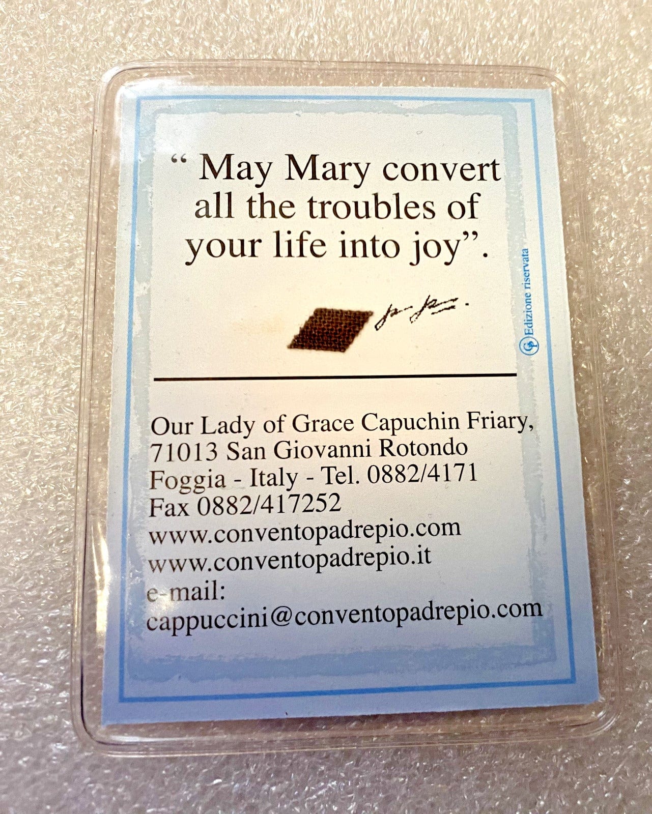 Vinyl encased Padre Pio 3rd Class Relic collectible from Italy, Christian relic with religious significance, by Bob and Penny Lord.