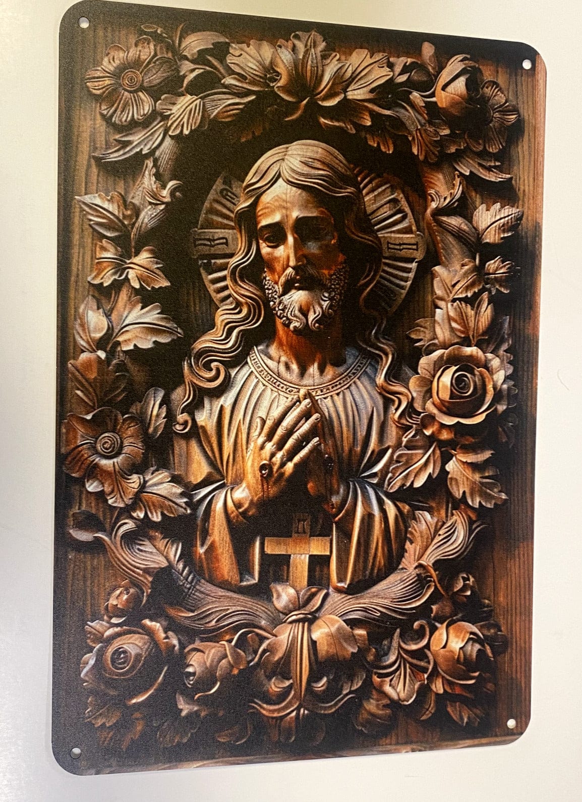 Imitation wood carving of Lord Jesus in a 2D metal nativity scene, detailed religious holiday collectible artwork.