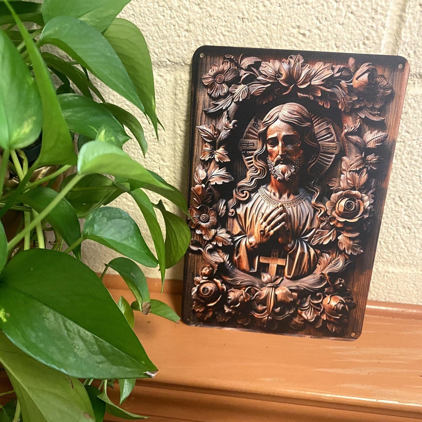 Imitation wood carving of Lord Jesus on metal, 2D nativity collectible, detailed religious holiday decor artwork.