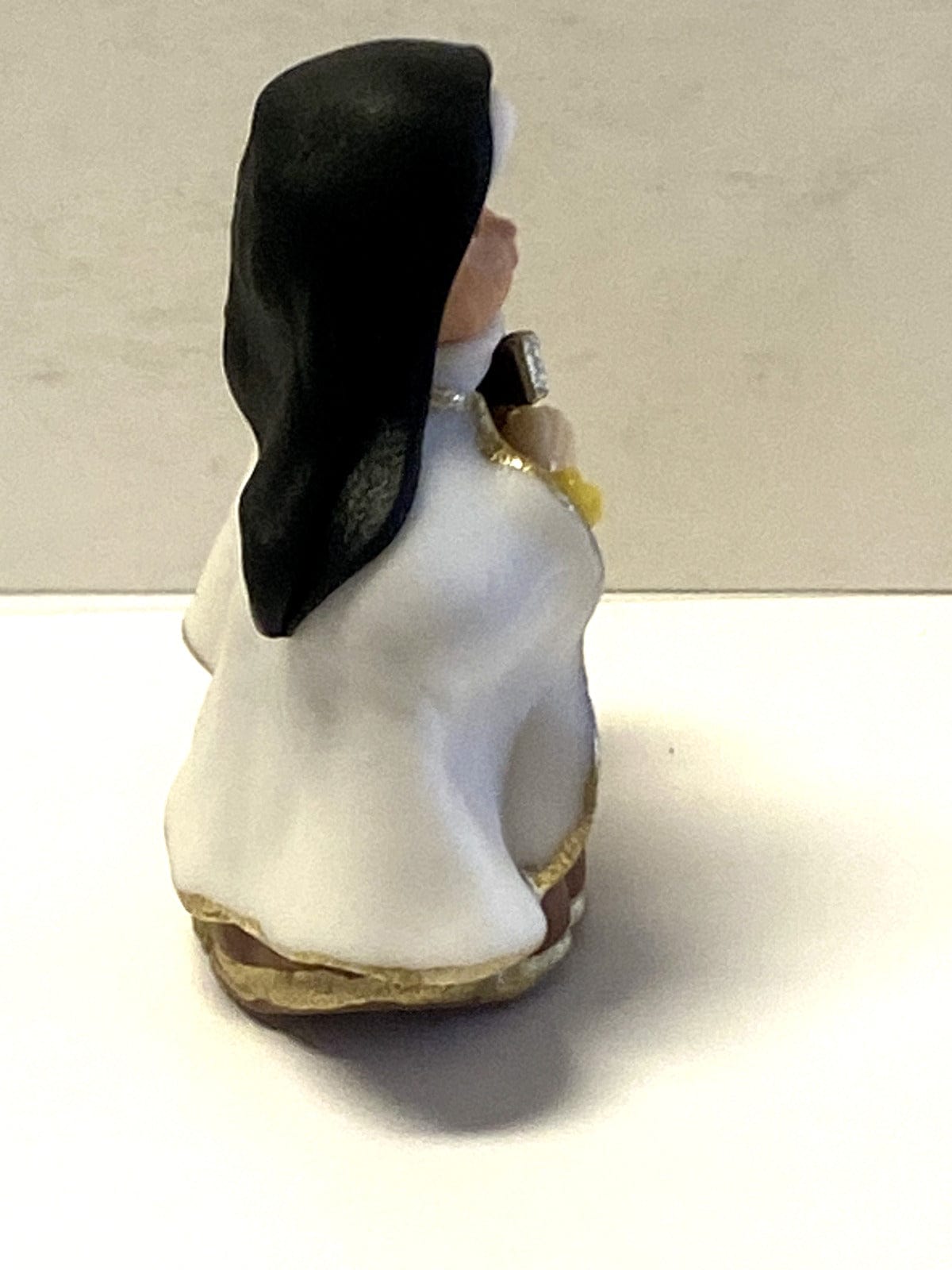 Miniature Saint Therese of Lisieux statue, 1.50 inches tall, religious collectible by Bob and Penny Lord, from Colombia.