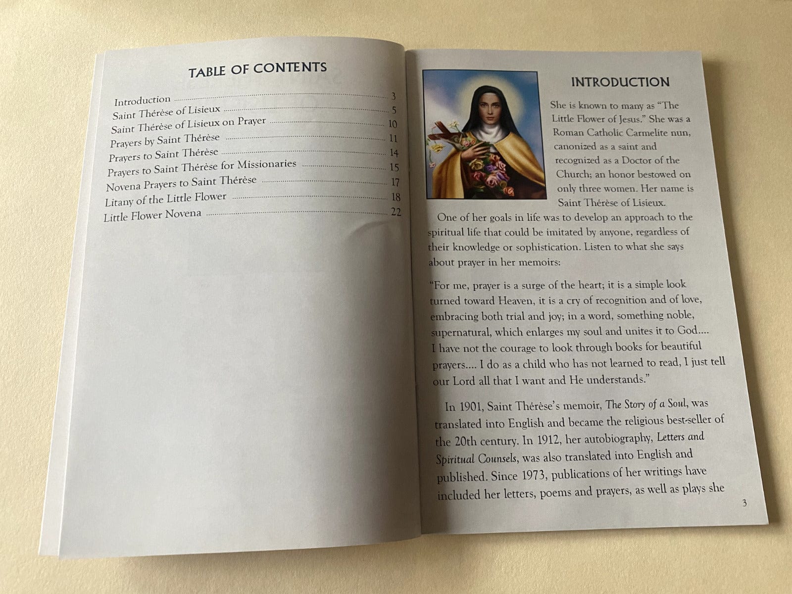 Saint Therese of Lisieux Holy Card by Bob and Penny Lord, featuring religious imagery and spiritual design.