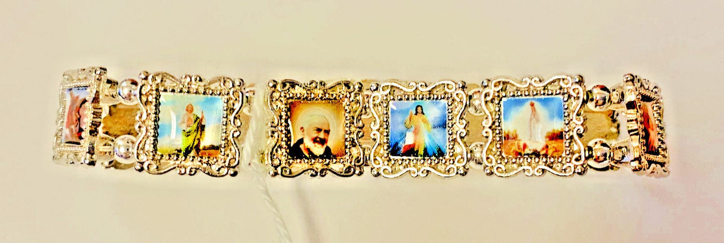 Silver bracelet featuring 11 saints, Christian jewelry by Bob and Penny Lord, with engraved saint images and intricate details.