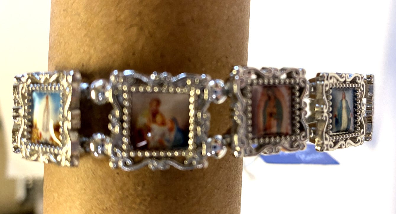 Silver bracelet featuring 11 saints, Christian jewelry by Bob and Penny Lord, with detailed saint engravings and a sleek design.