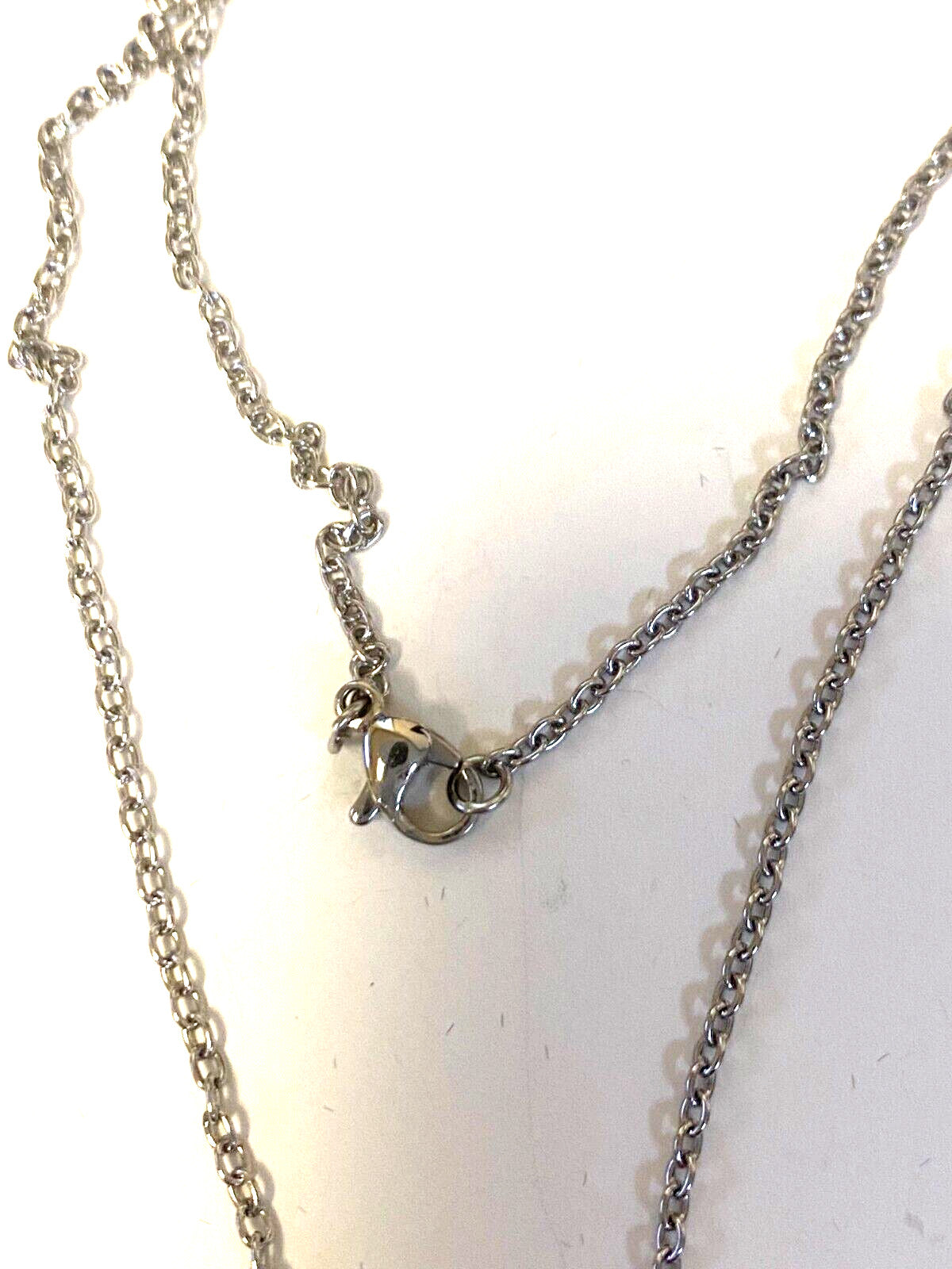 Tiny silver Sacred Heart and O L of Mount Carmel scapular charms, Christian religious collectibles by Bob and Penny Lord.