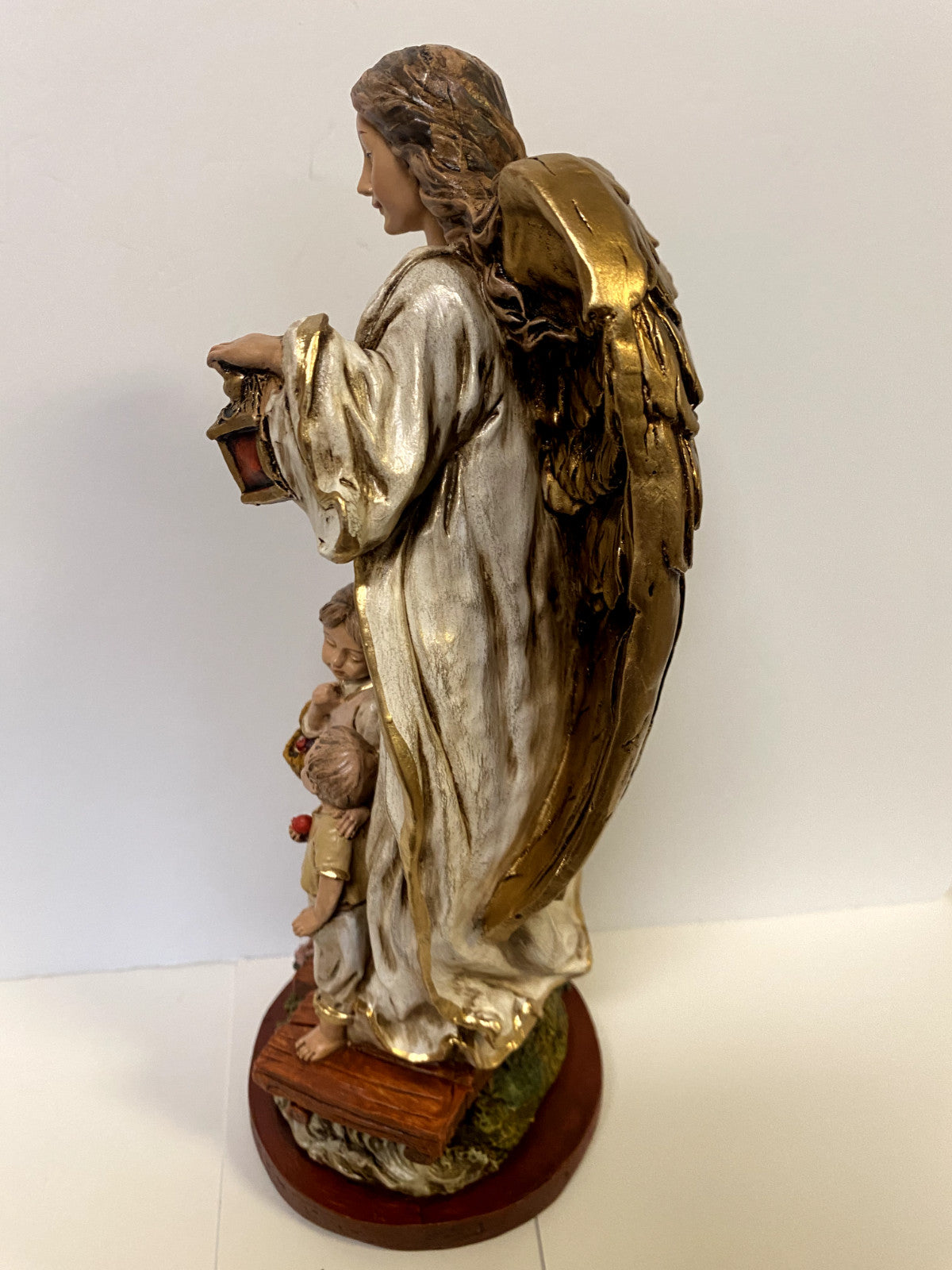 13-inch Guardian Angel statue from Colombia by Journeys of Faith, featuring detailed craftsmanship in religious collectible decor.