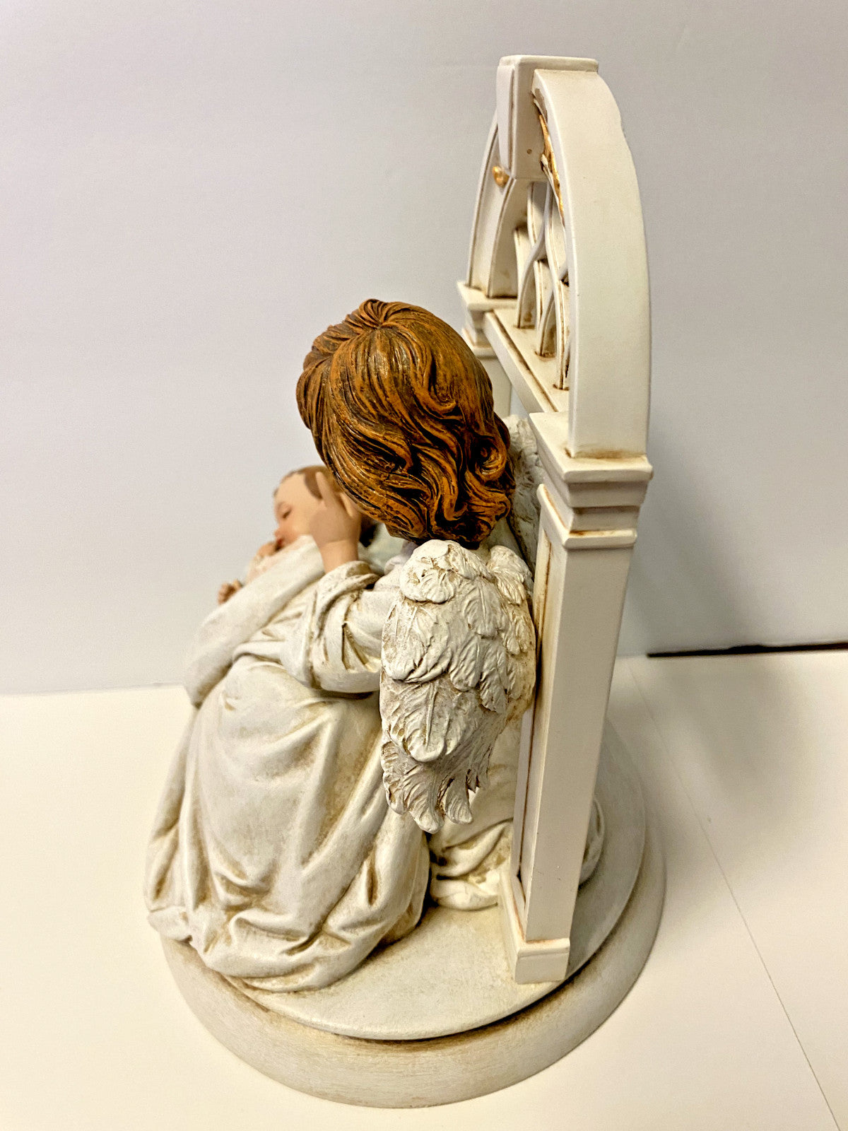 Roman collectible sculpture of a sleeping baby with angel wings, titled "Hush-A-Bye," 8-inch decorative figurine.