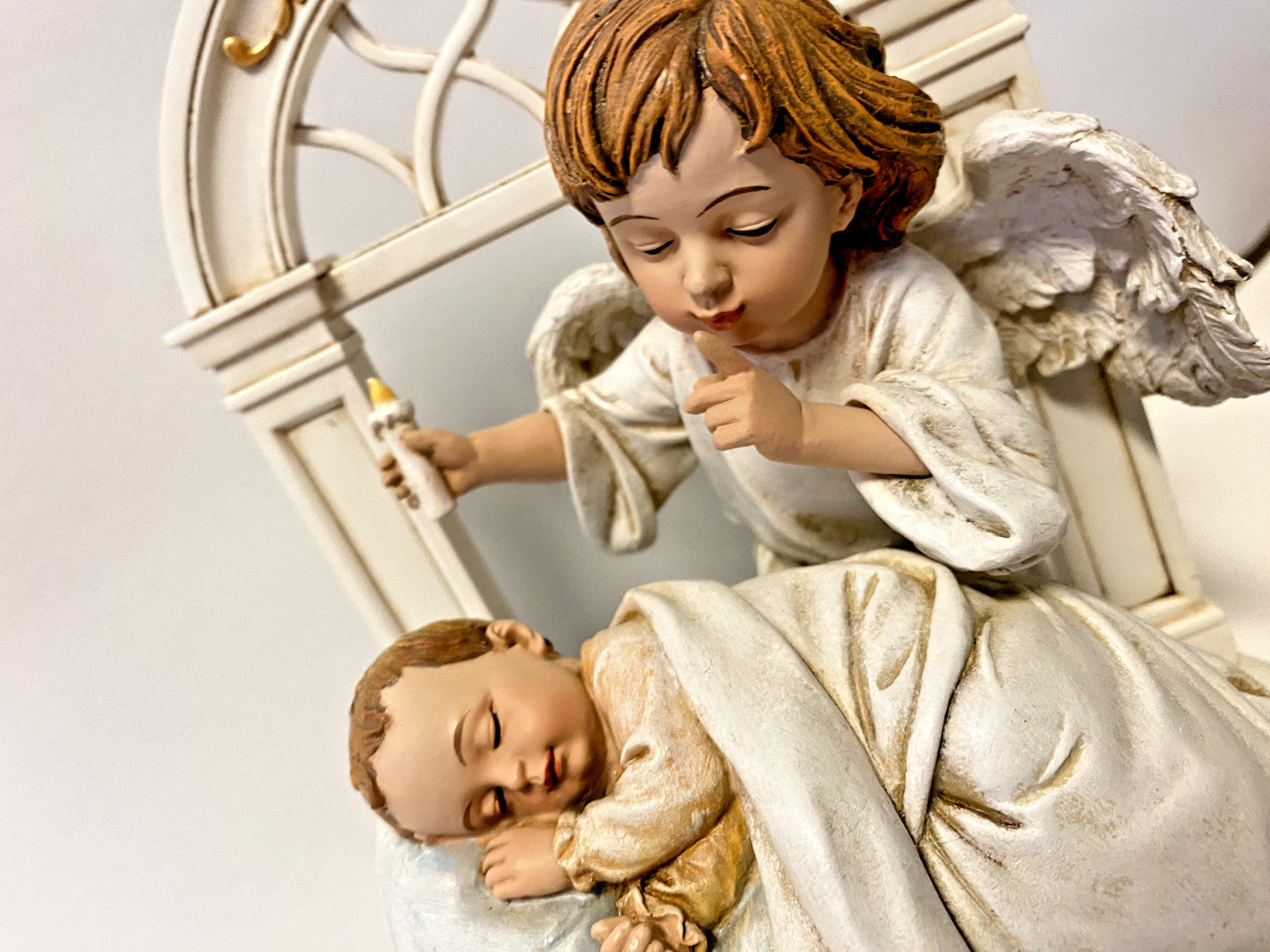 Roman decorative sculpture of a sleeping baby with angel wings, titled "Hush-A-Bye," 8-inch collectible figurine.