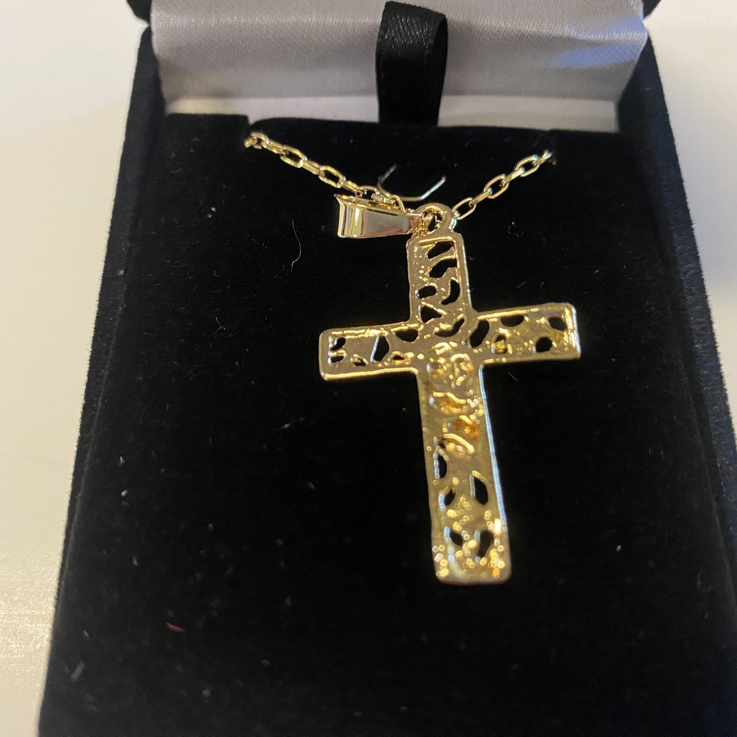 Brazilian gold-plated filigree crucifix necklace on a 20-inch chain, fashion jewelry pendant with intricate design.