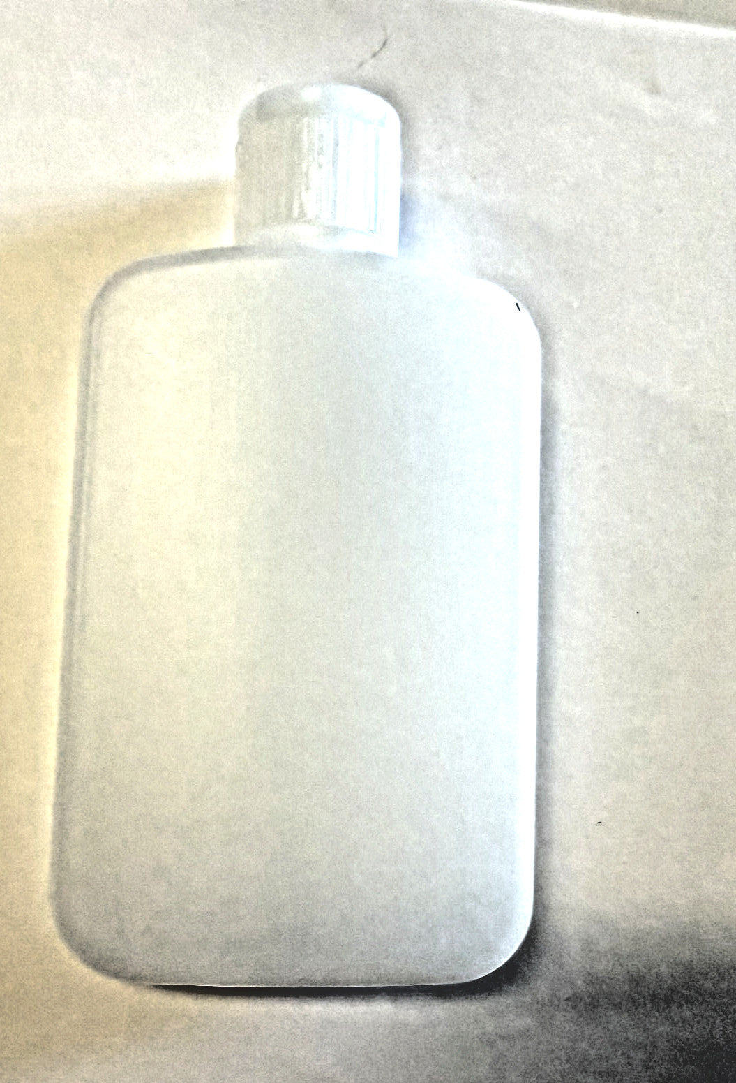 Small 4 oz. Holy Water Bottle with flip top by Journeys of Faith, designed for storing and carrying holy water.