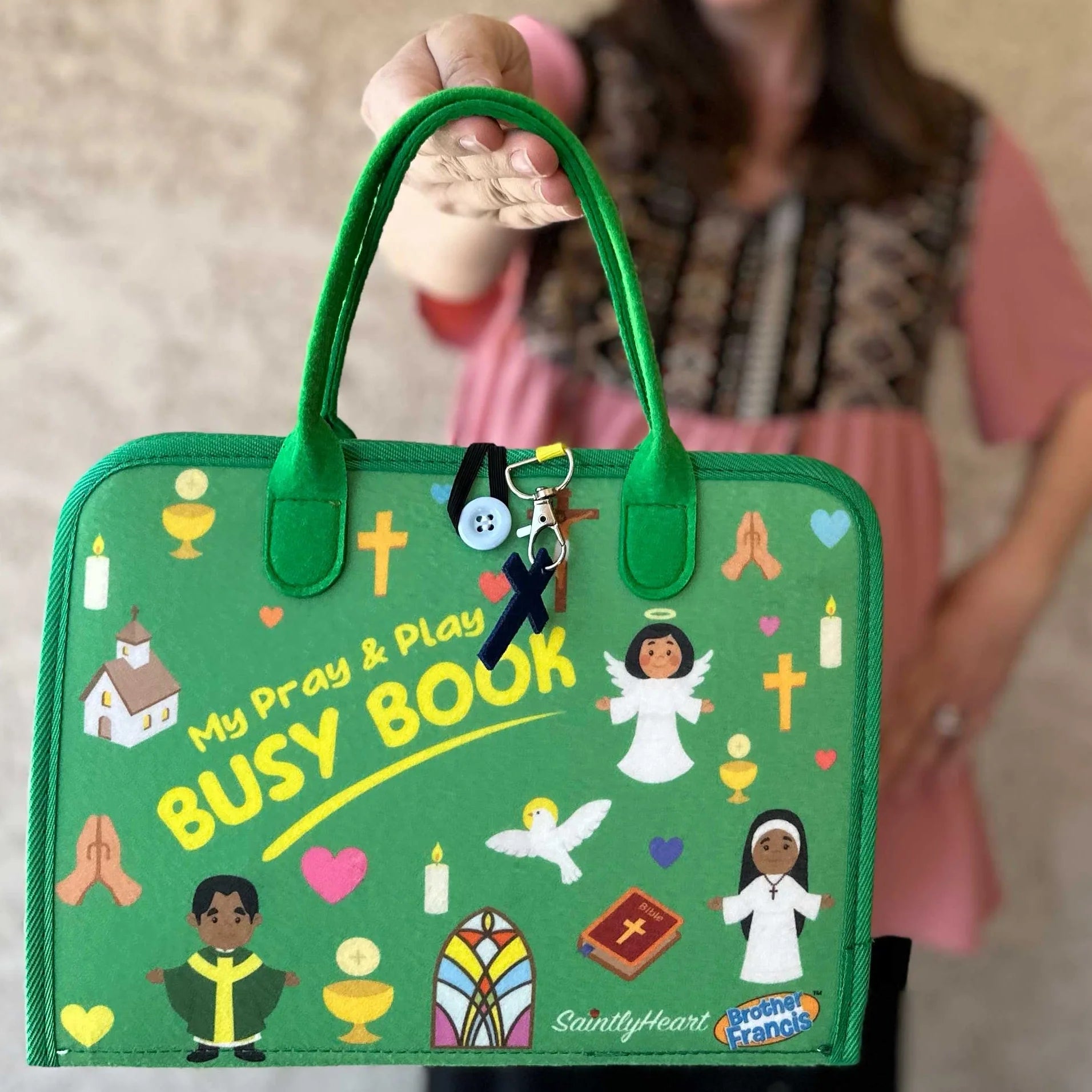 Brother Francis My Pray and Play Busy Book, a colorful felt quiet book with religious scenes and activities for children.