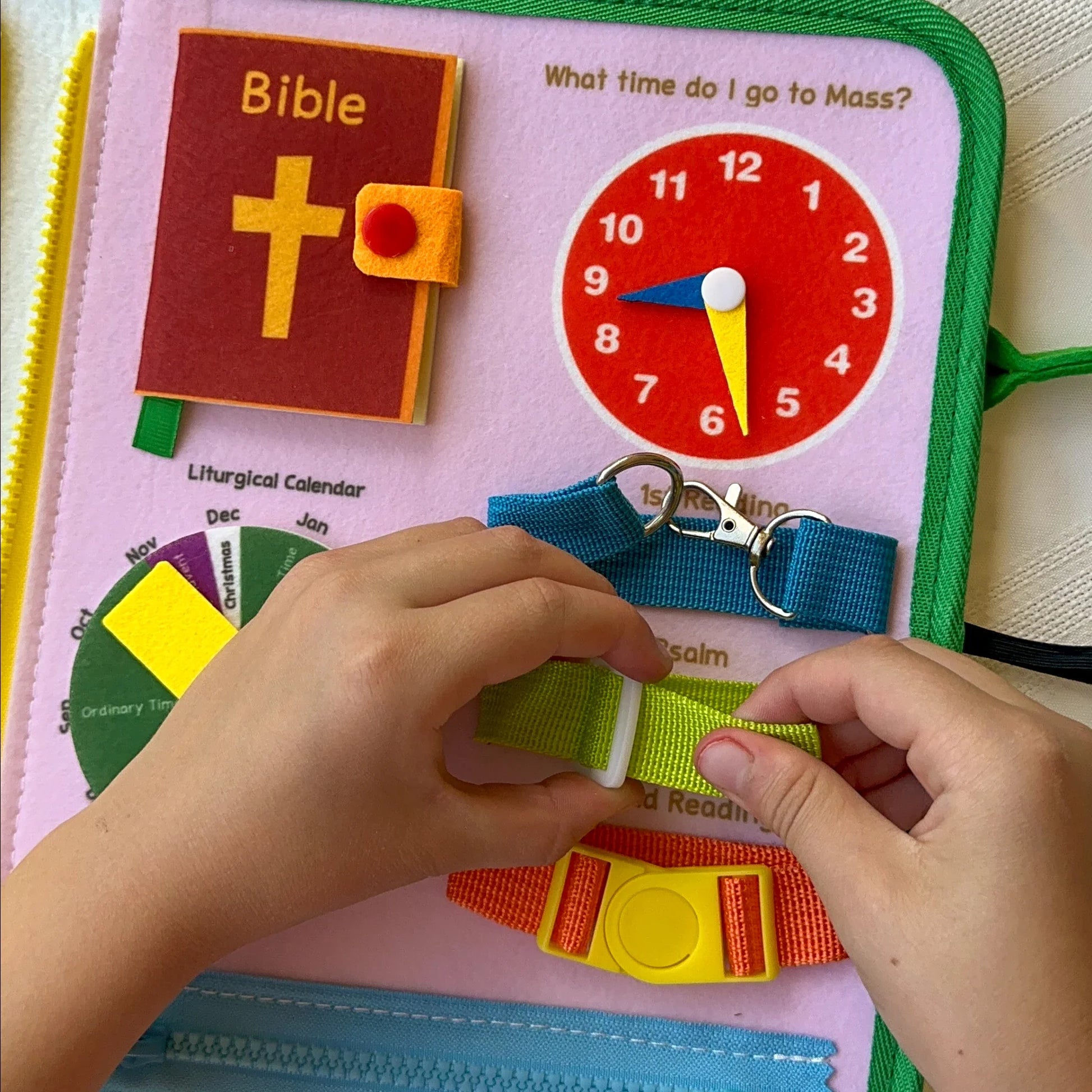 Brother Francis My Pray and Play Busy Book, a colorful felt quiet toy with religious activities for children.