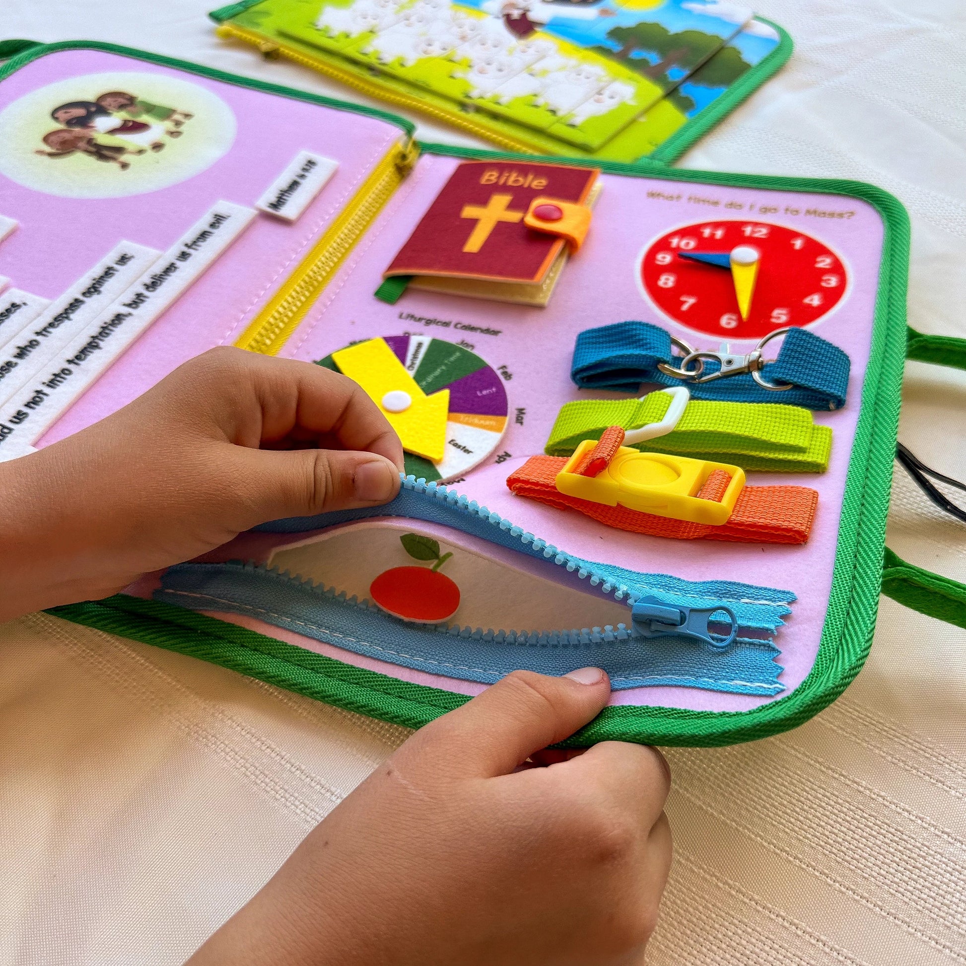 Brother Francis My Pray and Play Busy Book, a colorful felt quiet book with religious activities for children.