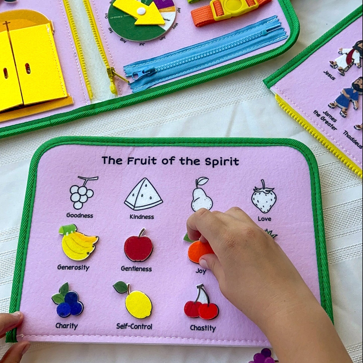 Brother Francis My Pray and Play Busy Book, colorful felt quiet toy with religious scenes for children’s play and learning.