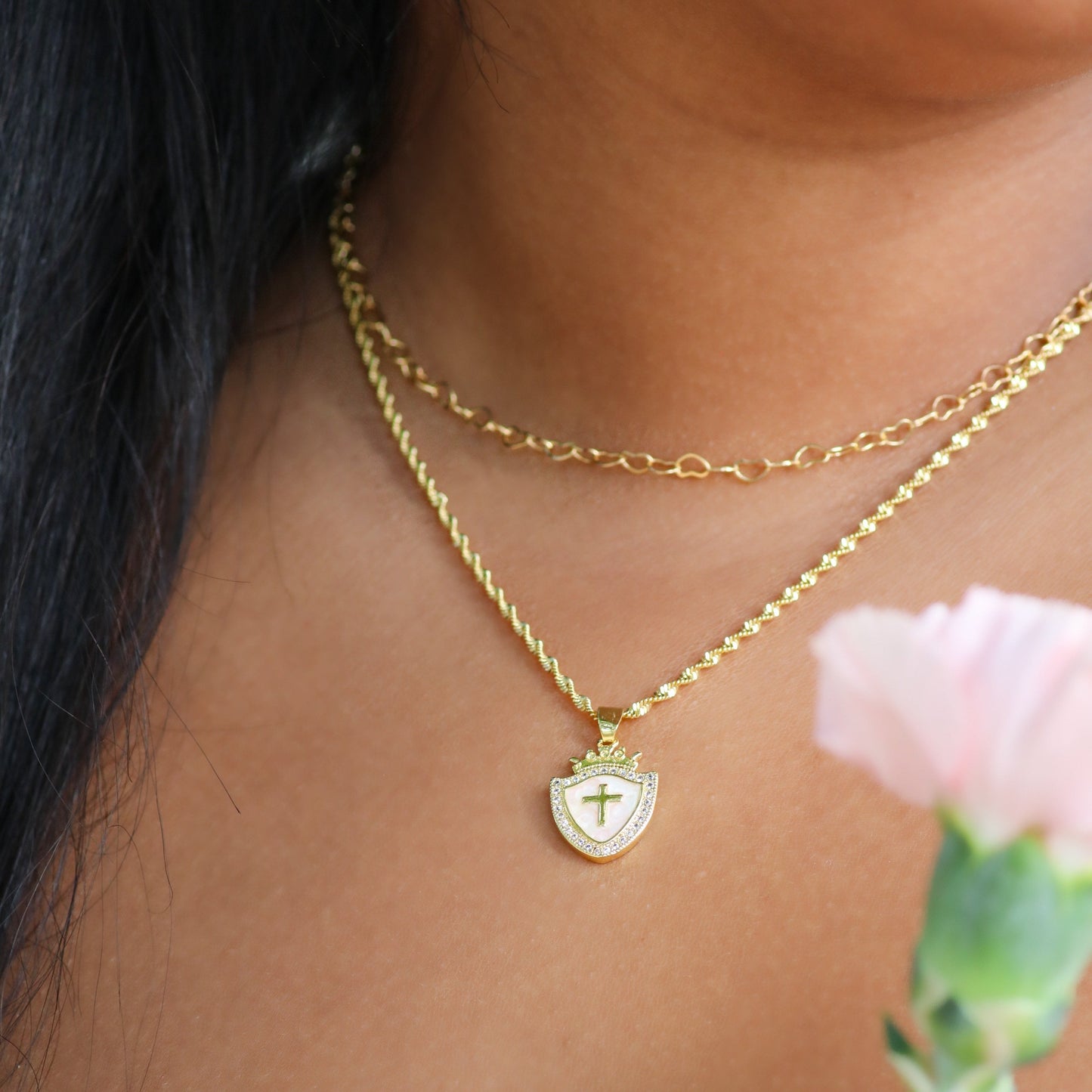Gold Shield of Faith Necklace from AMADI Jewelry featuring a Christian-inspired pendant with Ephesians 6:16 inscription.