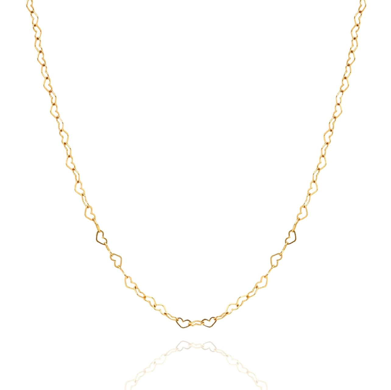 Gold and silver Joyful Hearts layering necklace by AMADI Jewelry featuring multiple heart-shaped pendants on delicate chains.