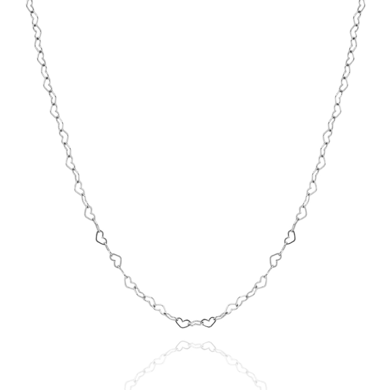 Gold and silver Joyful Hearts layering necklace by AMADI Jewelry, featuring delicate heart charms on a fine chain.
