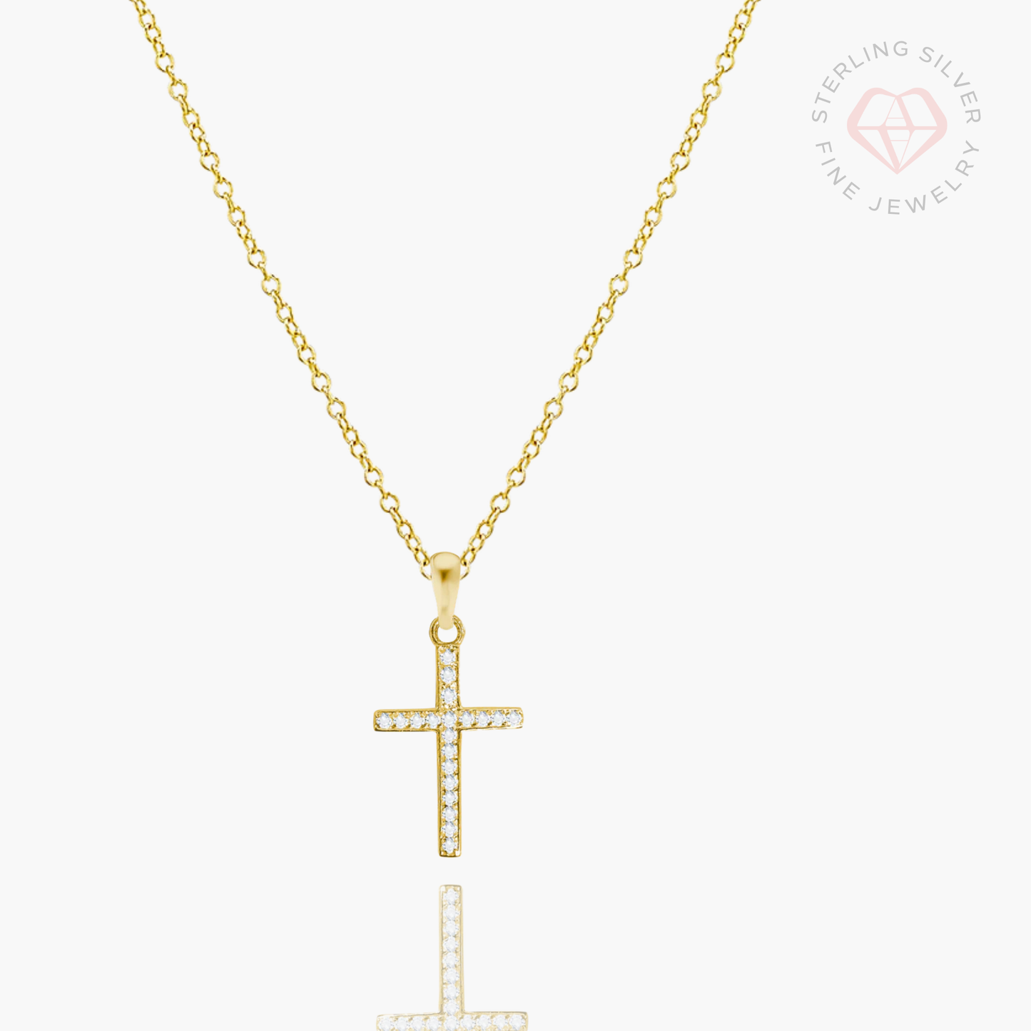 Gold vermeil and sterling silver cross necklace by AMADI Jewelry, featuring a delicate chain and detailed cross pendant.