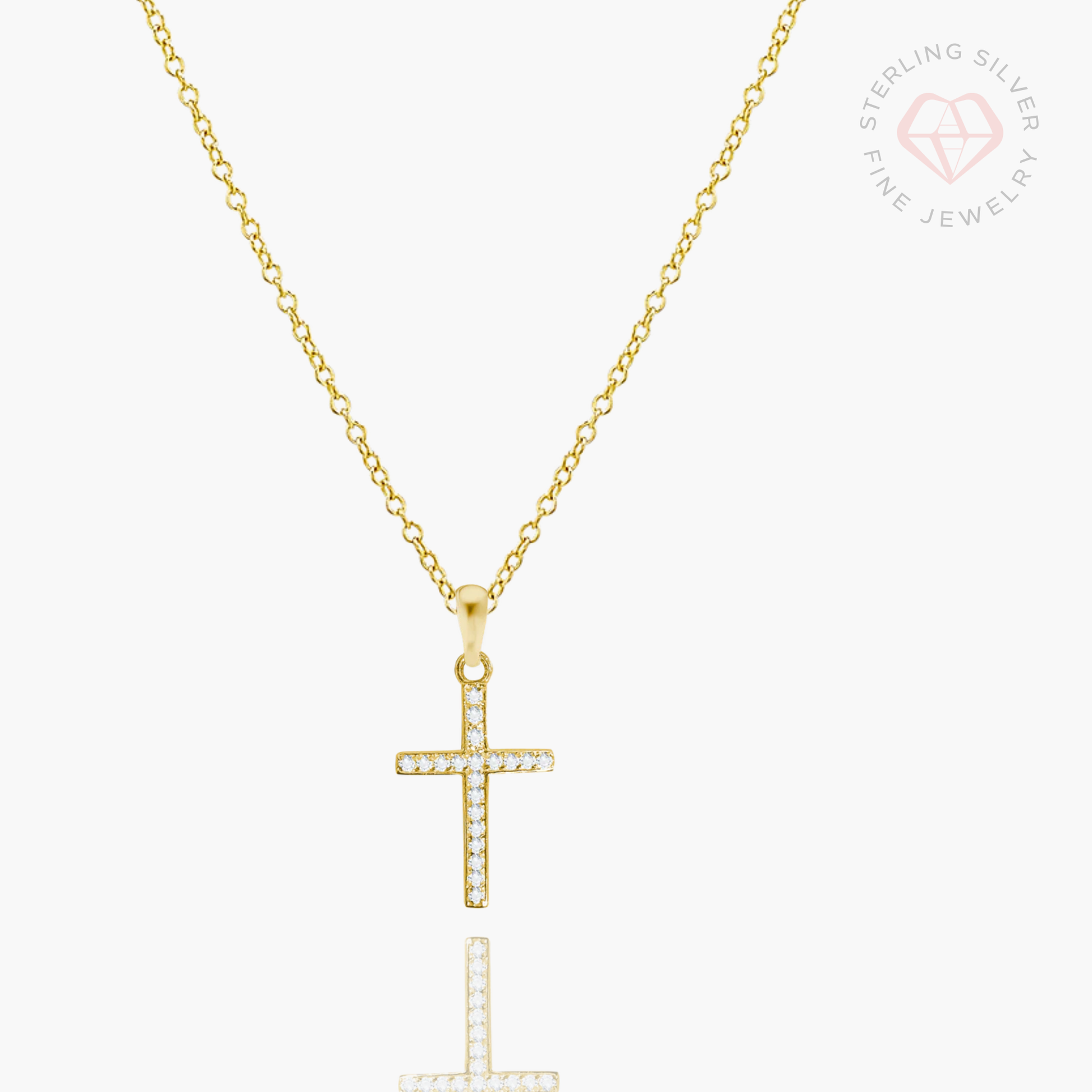 Gold vermeil and sterling silver cross necklace by AMADI Jewelry, featuring a delicate chain and detailed cross pendant.