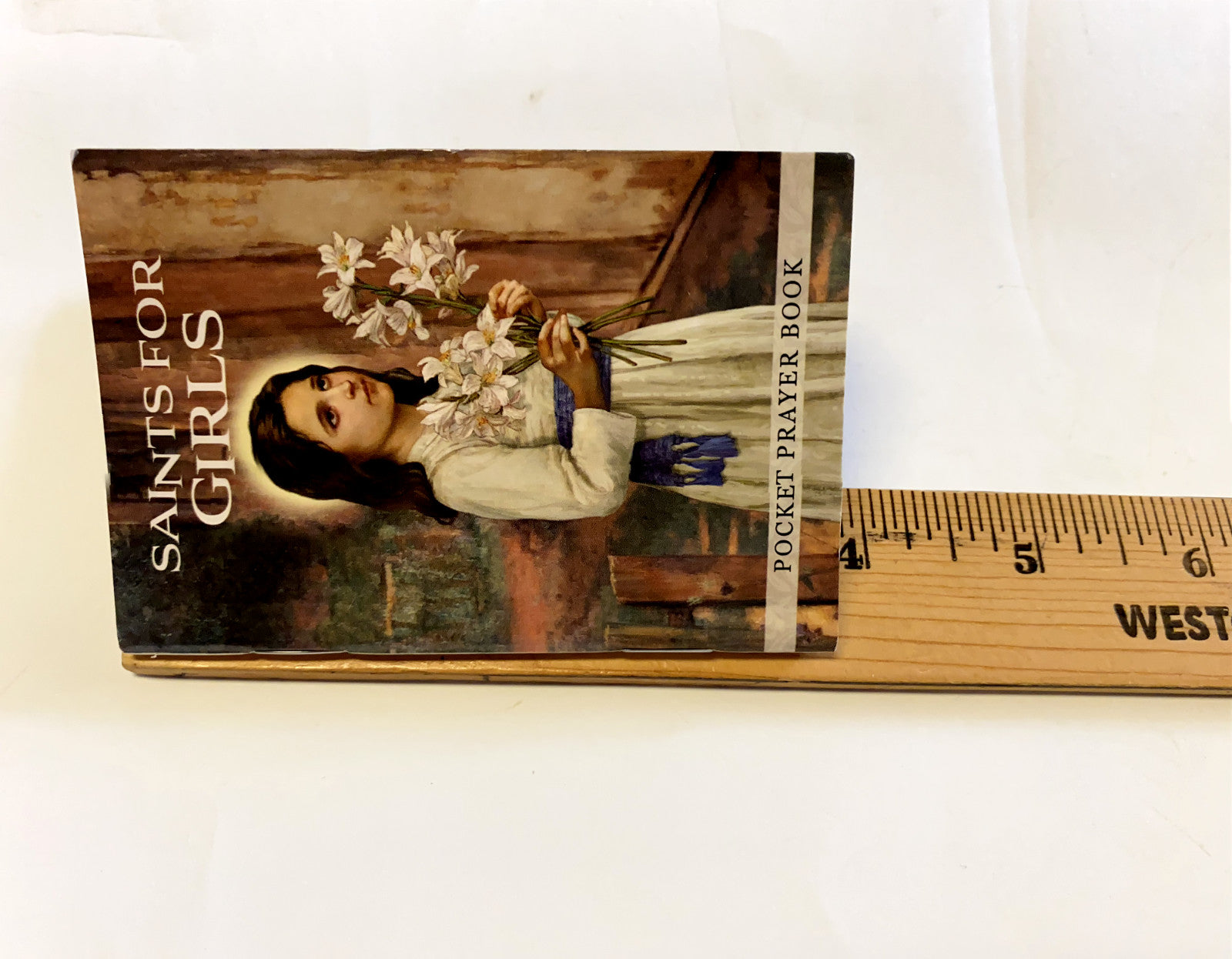Saints for Girls pocket prayer book by Bob and Penny Lord, featuring religious holy cards with Christian saints illustrations.