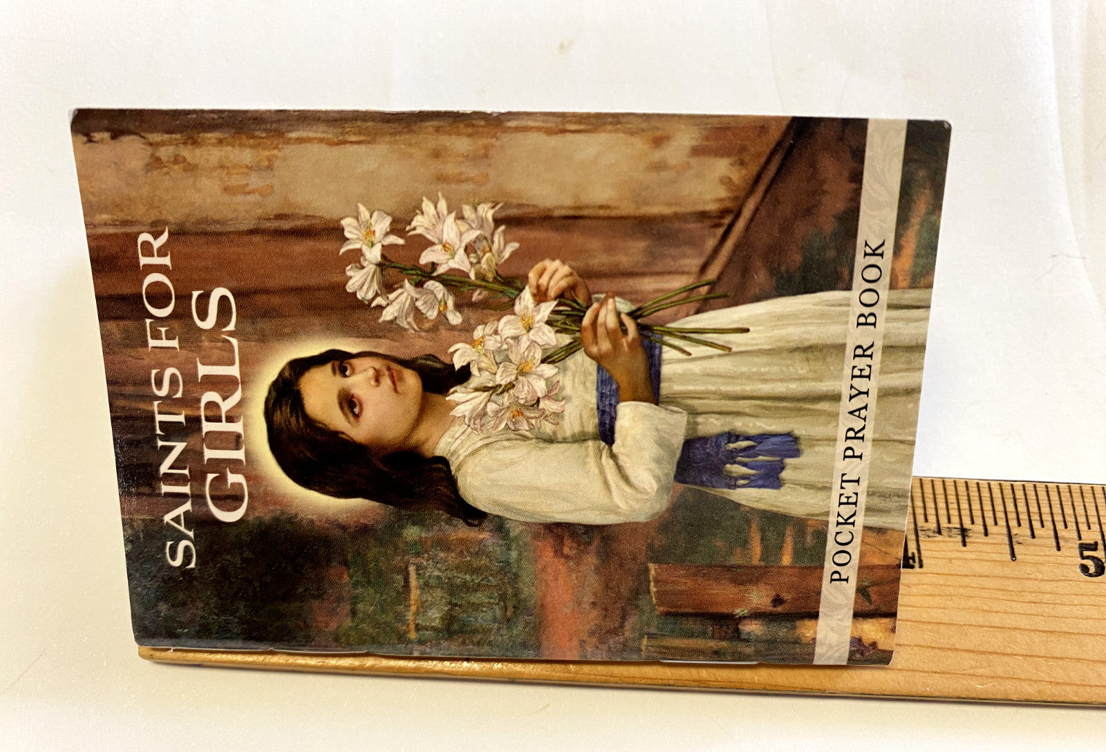 Saints for Girls pocket prayer book by Bob and Penny Lord, featuring religious holy card design for Christian spirituality.